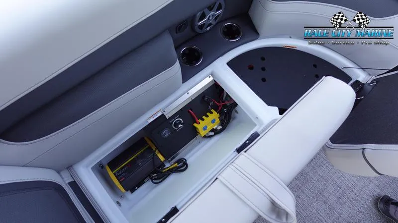 Slide: The Image of 2025 Barletta C24QC boat interior with open storage compartment and electrical components. - 35