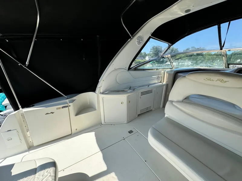 Slide: The Image of Interior view of 1999 Sea Ray 380 Sundancer yacht with seating and canopy. - 11