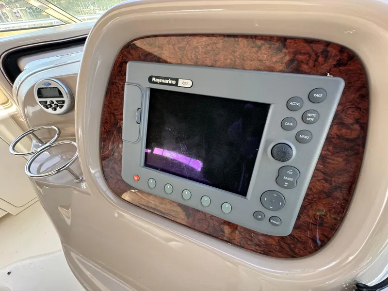 Slide: The Image of Control panel of 1999 Sea Ray 380 Sundancer with Raymarine navigation system. - 14