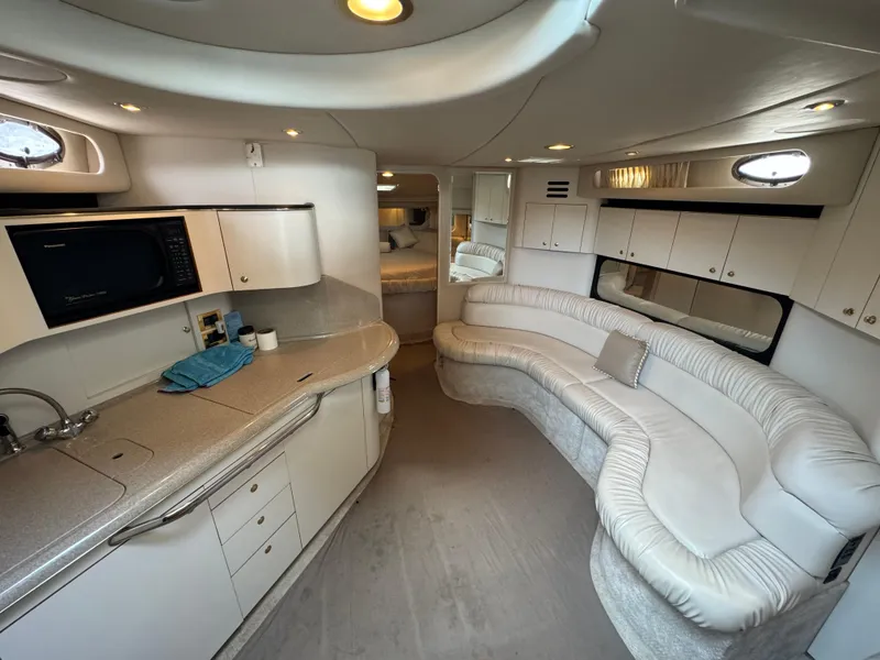 Slide: The Image of Luxurious interior of a 1999 Sea Ray 380 Sundancer yacht with modern amenities. - 17