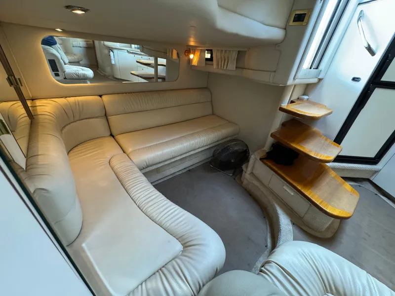 Slide: The Image of Luxurious interior of 1999 Sea Ray 380 Sundancer yacht with plush seating and elegant design. - 20