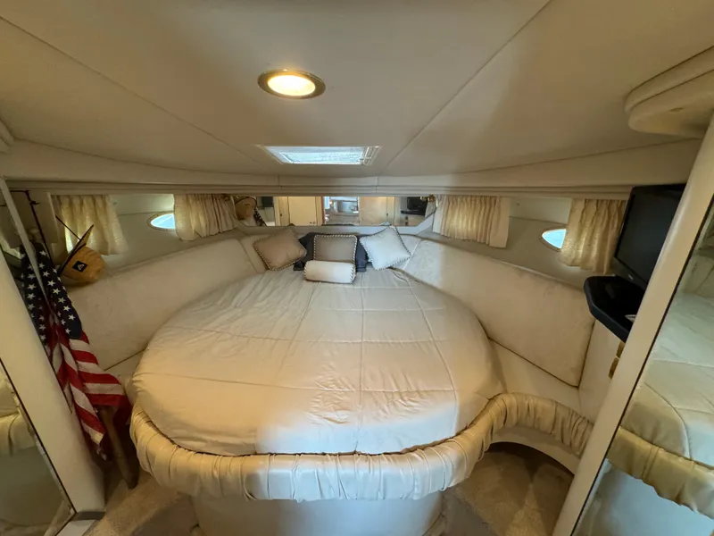Slide: The Image of Luxurious cabin interior of 1999 Sea Ray 380 Sundancer yacht with cozy bedding. - 21
