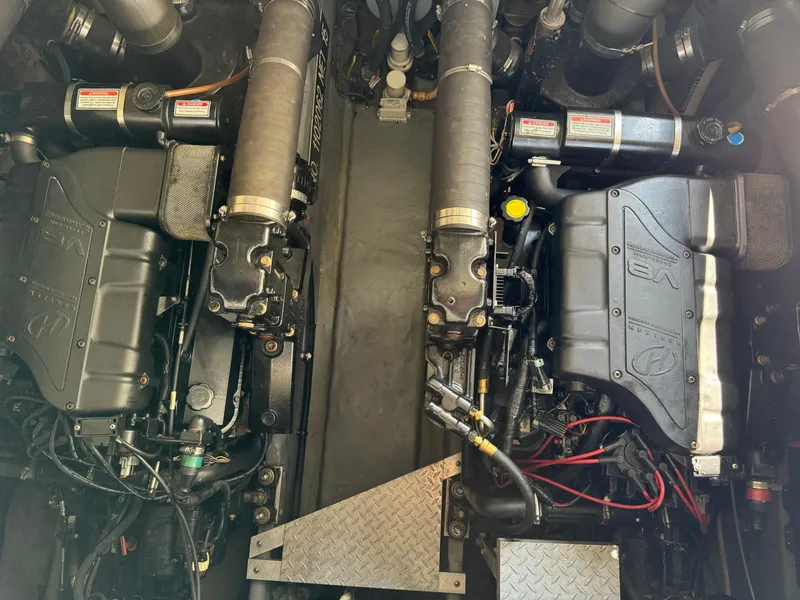 Slide: The Image of Engine compartment of a 1999 Sea Ray 380 Sundancer boat, showcasing dual engines. - 26