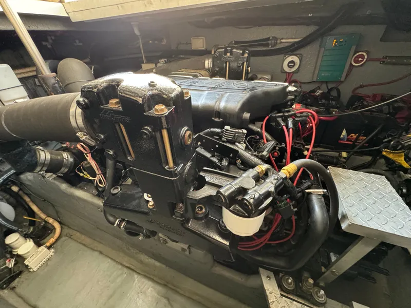 Slide: The Image of Engine room of a 1999 Sea Ray 380 Sundancer with visible components and wiring. - 27