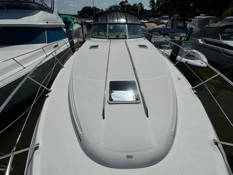 Slide: The Image of 1999 Sea Ray 380 Sundancer yacht docked at marina, top deck view. - 5