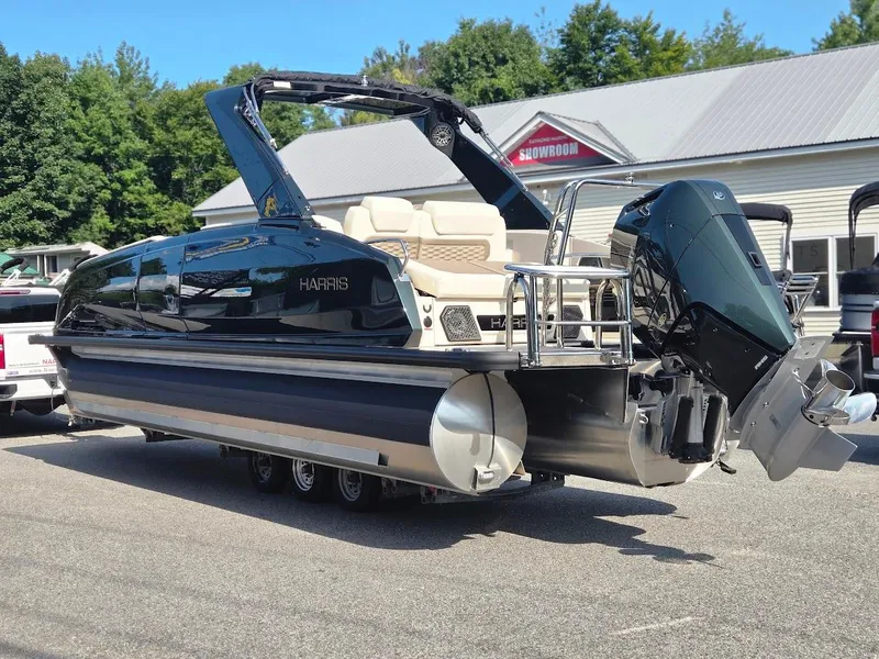 Slide: The Image of 2025 Harris Crowne SL 250 pontoon boat with powerful outboard motor. - 3