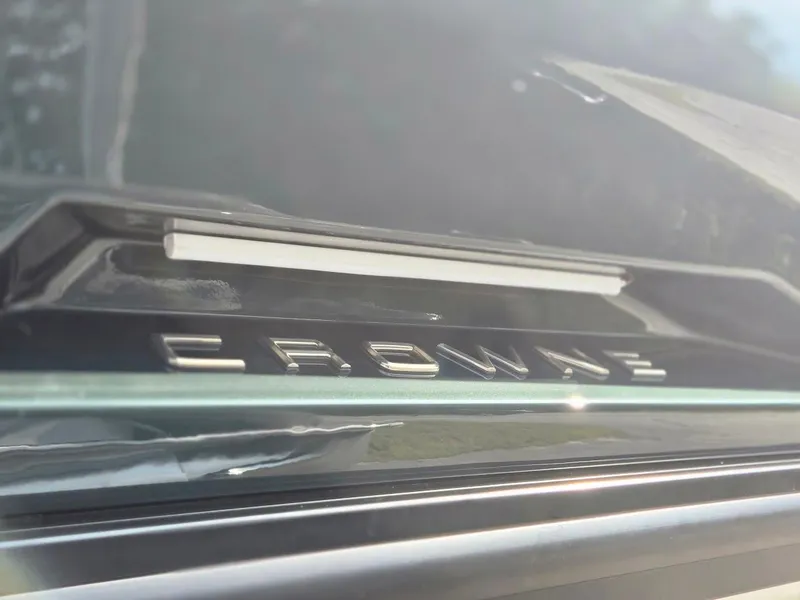 Slide: The Image of Close-up of 2025 Harris Crowne SL 250 logo on a sleek surface. - 4