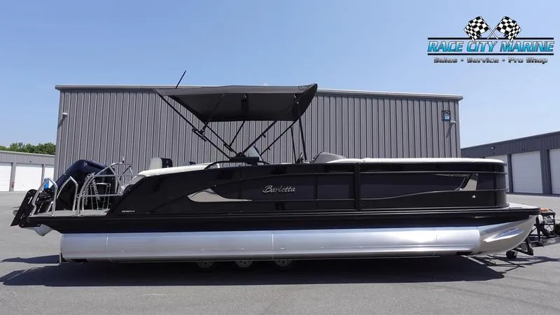 The Image of 2025 Barletta L25M pontoon boat with canopy, parked at Race City Marine. - 0