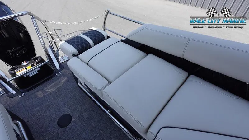 Slide: The Image of 2025 Barletta L25M pontoon boat interior with plush seating and modern design. - 16