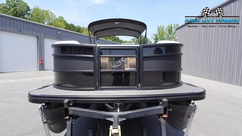Slide: The Image of 2025 Barletta L25M pontoon boat on trailer at Race City Marine. - 2