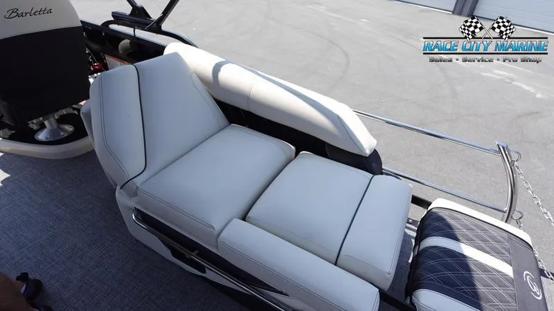 Slide: The Image of 2025 Barletta L25M boat with luxurious white seating, Race City Marine logo visible. - 23