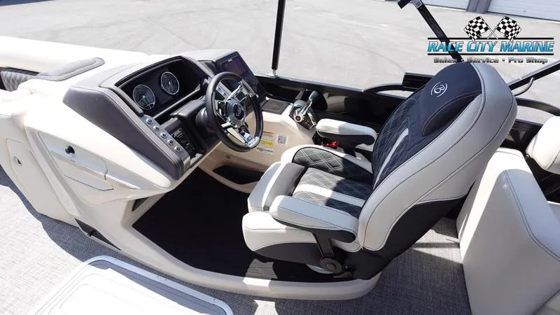Slide: The Image of 2025 Barletta L25M boat interior with modern dashboard and comfortable seating. - 26