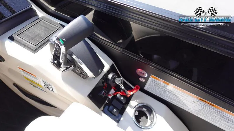 Slide: The Image of 2025 Barletta L25M boat control panel with throttle and cup holder. - 28