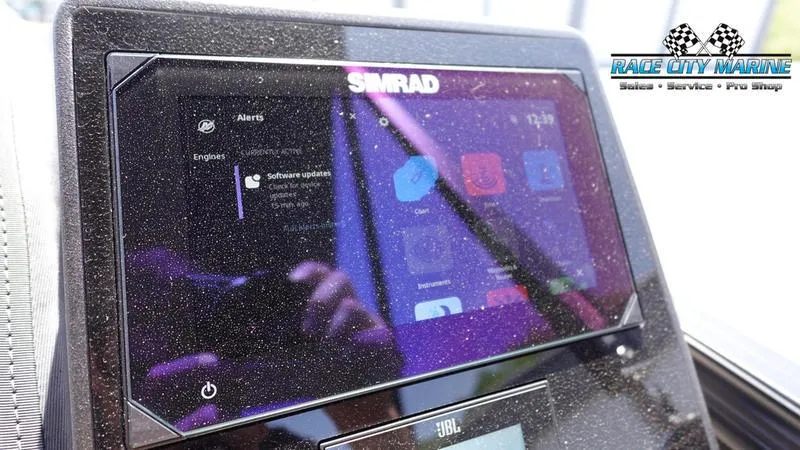 Slide: The Image of Simrad display on 2025 Barletta L25M boat, showing software update alert. - 32