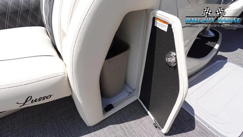 Slide: The Image of Barletta L25M 2025 boat interior with storage compartment and white seating. - 34