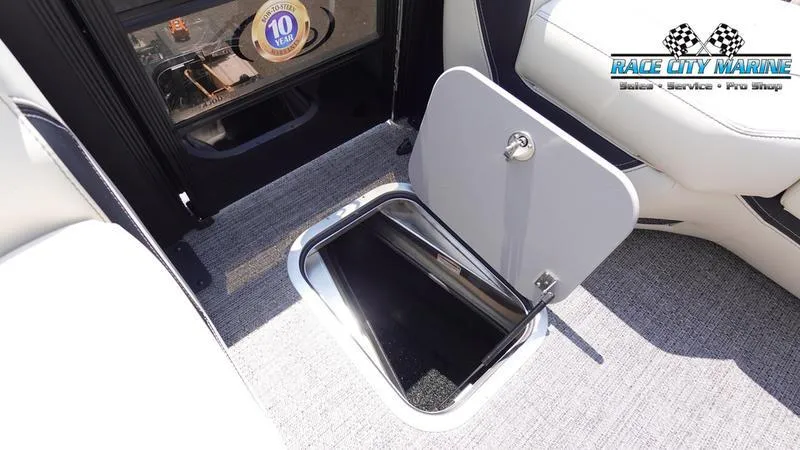 Slide: The Image of Barletta L25M 2025 boat interior with open storage compartment and Race City Marine logo. - 35