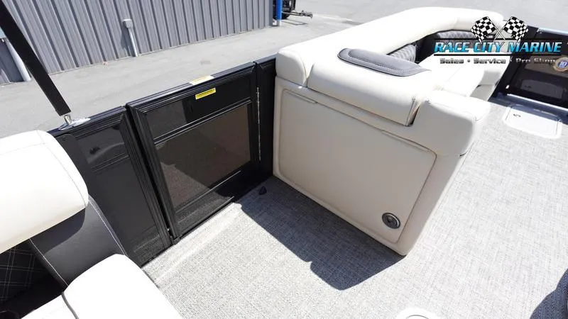 Slide: The Image of 2025 Barletta L25M boat interior with beige seating and black gate. - 38