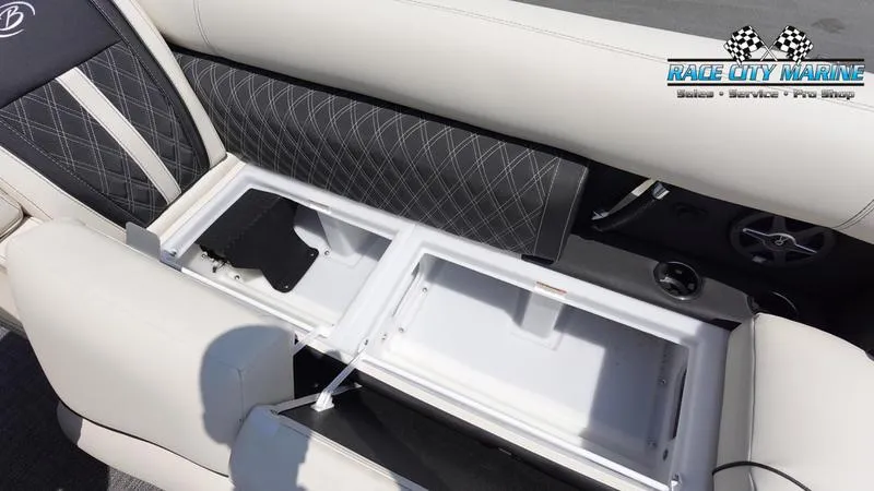 Slide: The Image of 2025 Barletta L25M boat interior with open storage compartment and Race City Marine logo. - 48