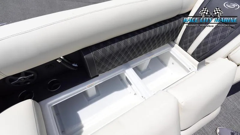 Slide: The Image of Barletta L25M 2025 boat interior with open storage compartments and cushioned seating. - 49