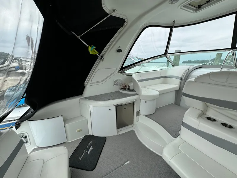 Slide: The Image of Interior of 2007 Formula 40 PC yacht with white seating and modern design. - 12