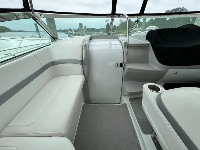 Slide: The Image of 2007 Formula 40 PC boat interior with white seating and sleek design. - 14