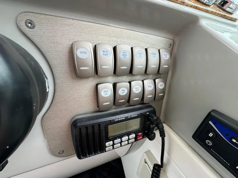 Slide: The Image of Control panel of a 2007 Formula 40 PC boat with switches and radio. - 19