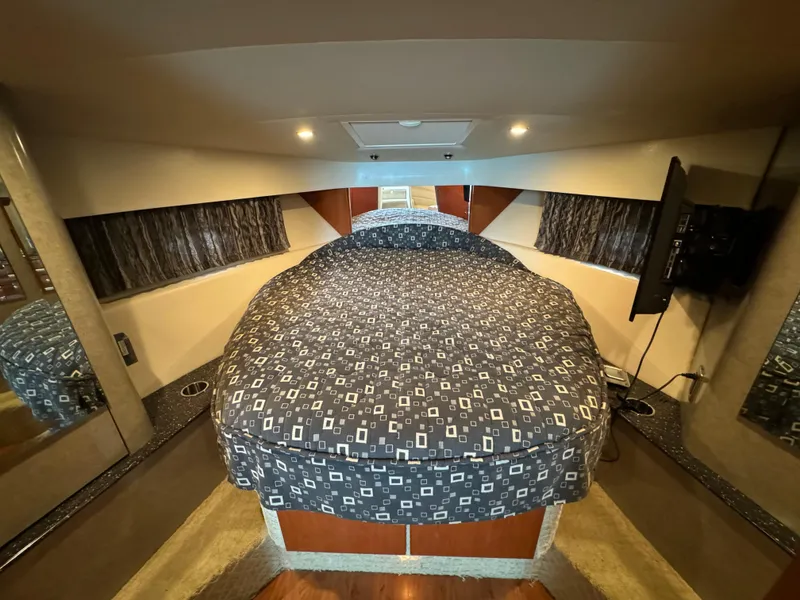 Slide: The Image of Luxurious 2007 Formula 40 PC yacht cabin with cozy bed and modern decor. - 24