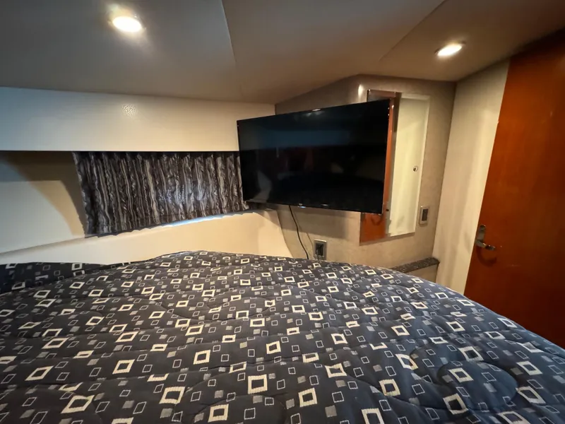 Slide: The Image of Interior of 2007 Formula 40 PC yacht with bed, TV, and modern lighting. - 26