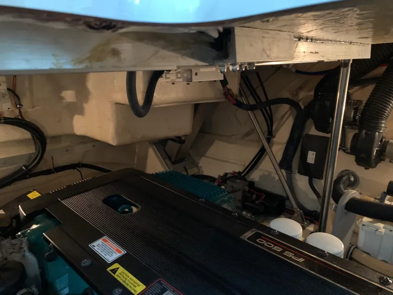 Slide: The Image of Engine compartment of a 2007 Formula 40 PC boat, showcasing mechanical components and wiring. - 32