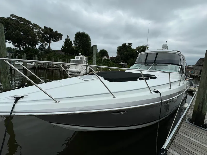 Slide: The Image of 2007 Formula 40 PC yacht docked at marina under cloudy sky. - 4