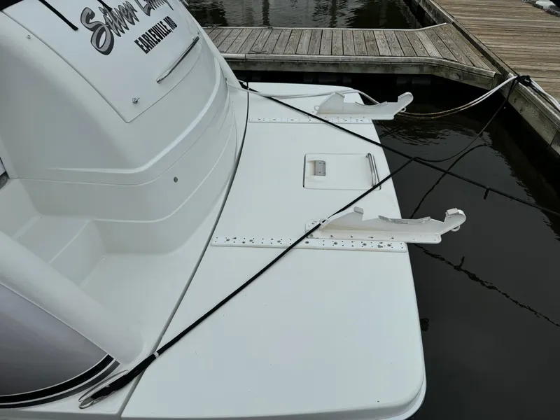 Slide: The Image of 2007 Formula 40 PC boat docked, showing rear deck and mooring lines. - 9