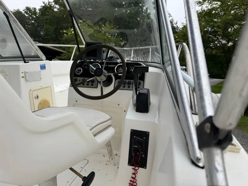 Slide: The Image of Key West 1900 Dual Console boat interior, steering wheel, and controls, 2000 model. - 9