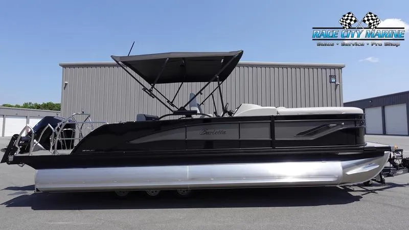 The Image of 2025 Barletta X23UC pontoon boat with canopy, parked at Race City Marine. - 0