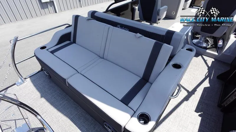 Slide: The Image of 2025 Barletta X23UC boat interior with gray seating and cup holders. - 15