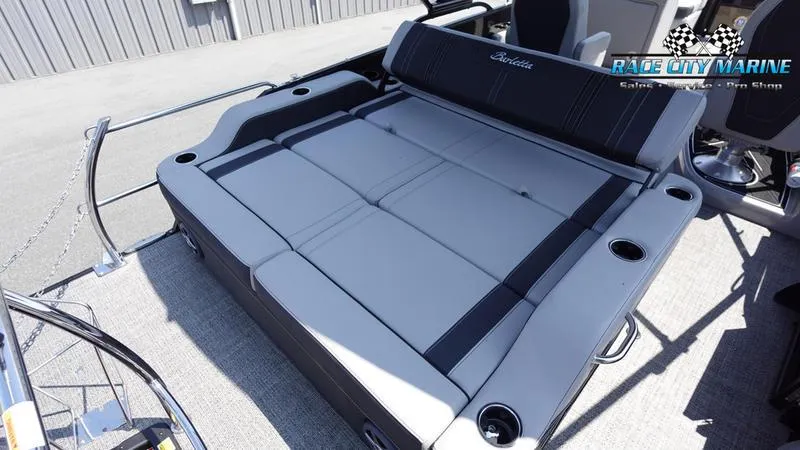 Slide: The Image of 2025 Barletta X23UC boat with spacious seating and cup holders. - 16