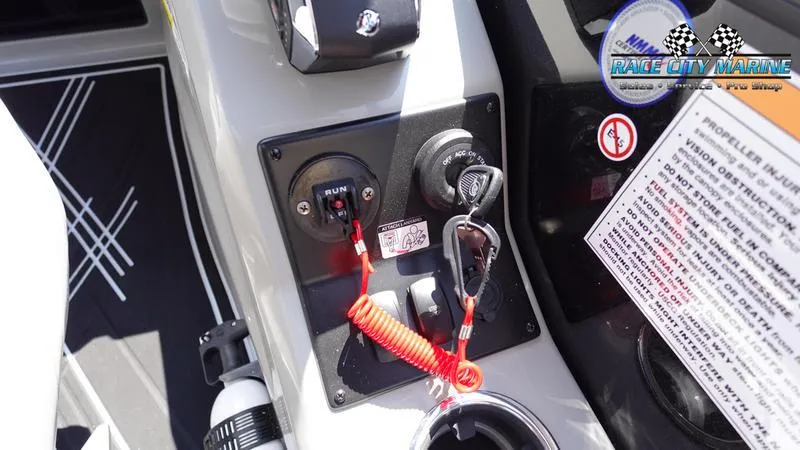 Slide: The Image of 2025 Barletta X23UC boat control panel with safety features and Race City Marine branding. - 20