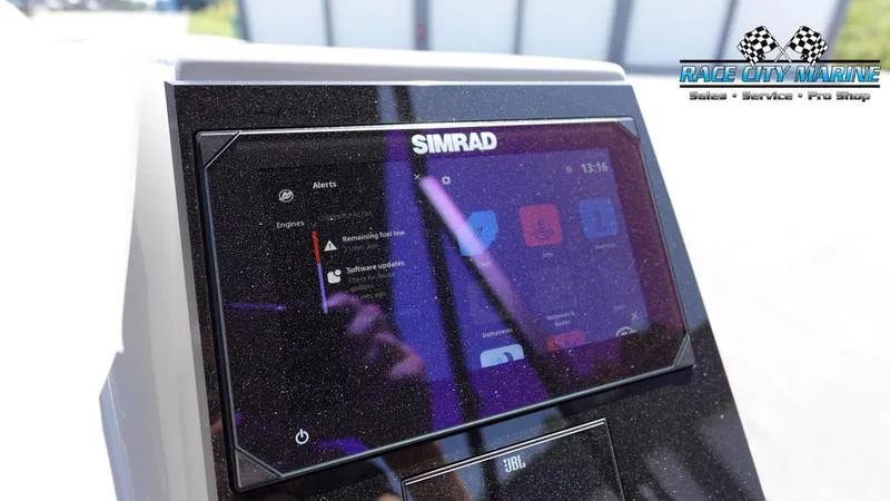 Slide: The Image of Simrad display on 2025 Barletta X23UC boat dashboard, Race City Marine logo visible. - 22