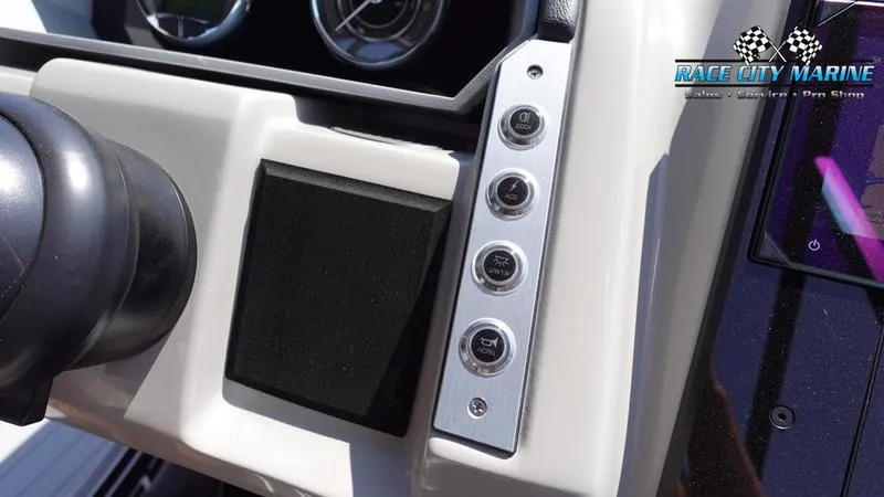Slide: The Image of Dashboard controls of 2025 Barletta X23UC boat by Race City Marine. - 24