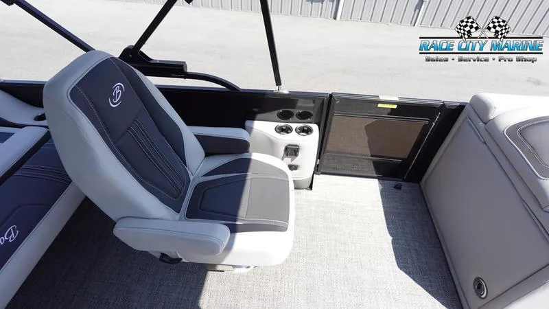Slide: The Image of 2025 Barletta X23UC boat interior with gray seating and cup holders. - 27