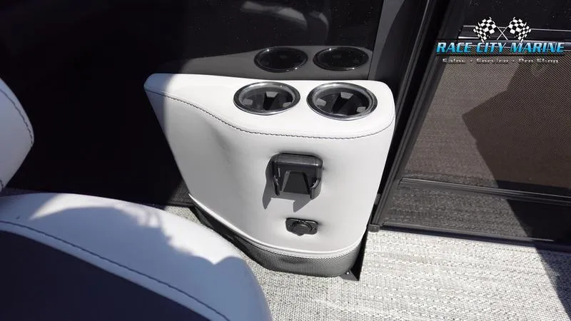 Slide: The Image of Barletta X23UC 2025 boat interior with cup holders and Race City Marine logo. - 28