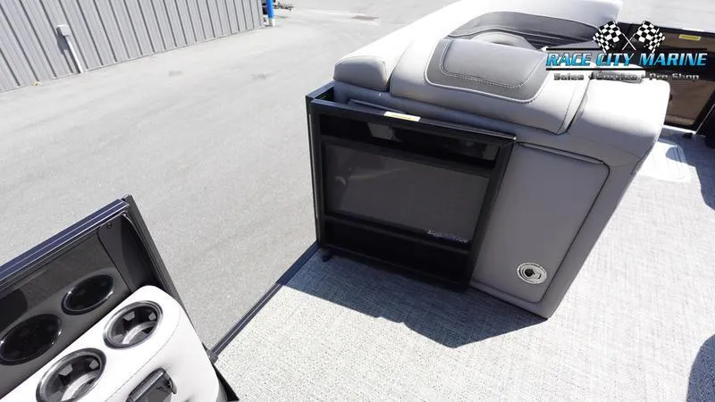 Slide: The Image of 2025 Barletta X23UC boat interior with seating and storage compartments. - 32