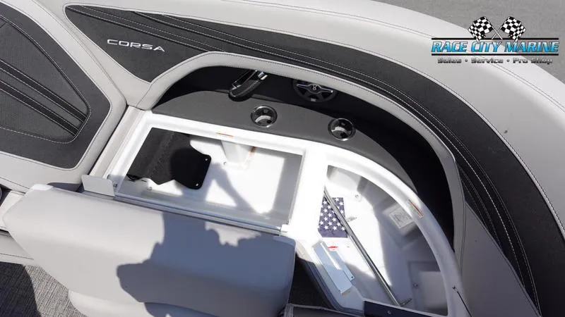 Slide: The Image of Interior of 2025 Barletta X23UC boat with storage compartment and cup holders. - 41