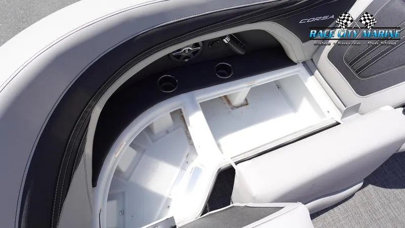 Slide: The Image of 2025 Barletta X23UC boat interior with storage compartments and cup holders. - 42
