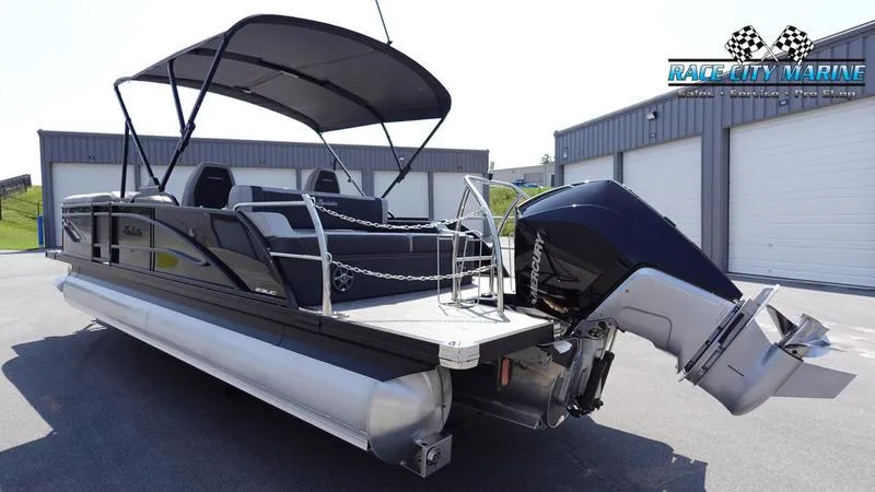 Slide: The Image of 2025 Barletta X23UC pontoon boat with canopy and powerful outboard motor. - 7