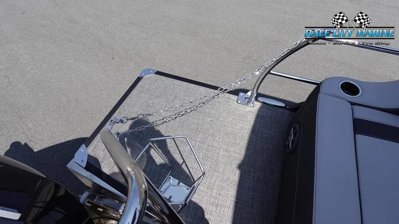 Slide: The Image of 2025 Barletta X23UC boat deck with chain and railing, Race City Marine logo. - 8