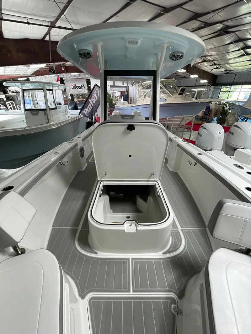 Slide: The Image of 2025 Parker 2600 Center Console boat interior with open storage compartment. - 5