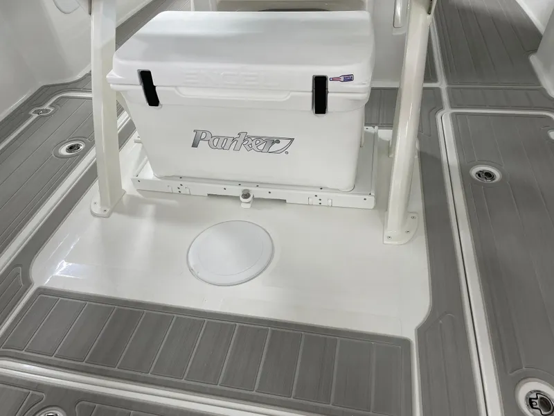 Slide: The Image of 2025 Parker 2600 Center Console boat deck with cooler and non-slip flooring. - 8