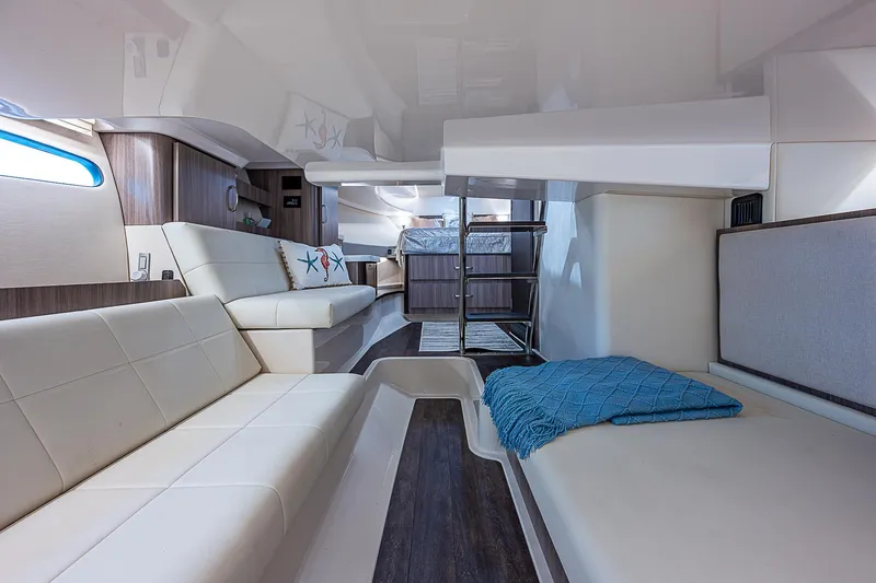 Slide: The Image of Interior of 2022 Regal 36 XO yacht with modern seating and cozy decor. - 17
