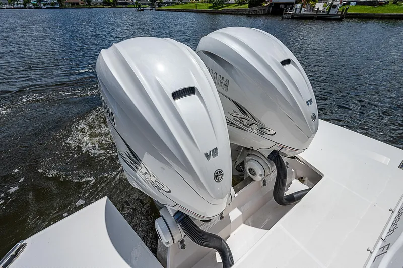 Slide: The Image of Twin Yamaha outboard engines on a 2022 Regal 36 XO boat. - 28
