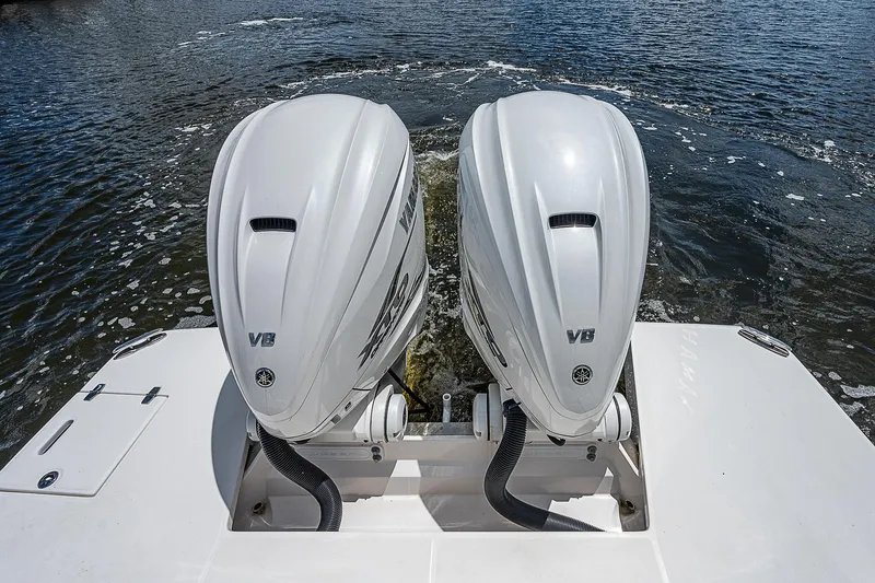 Slide: The Image of 2022 Regal 36 XO boat with twin V8 engines on water. - 29
